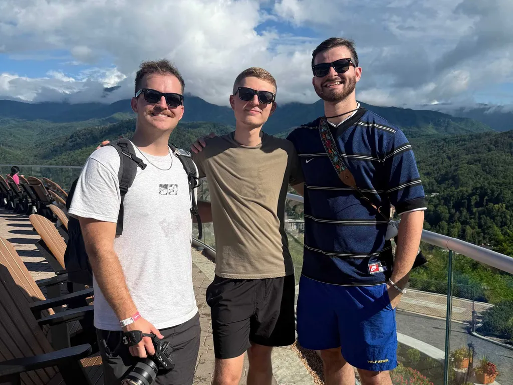 Michael Gilbert, Cameron Downey, and Anthony Fratto, the founders of Rig Designer, in front of a mountain view